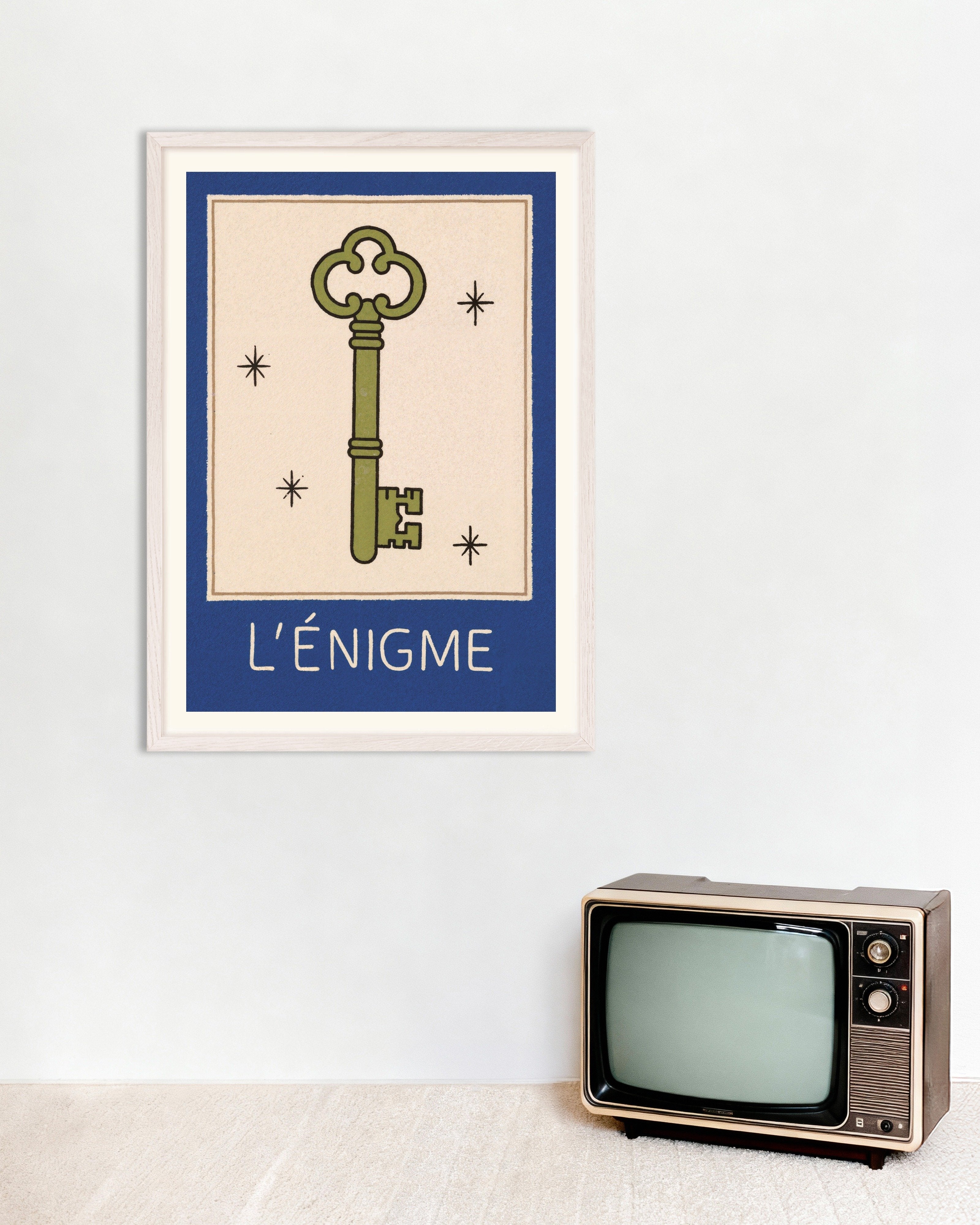 Poster of L'Énigme Key Poster, with white wooden frame